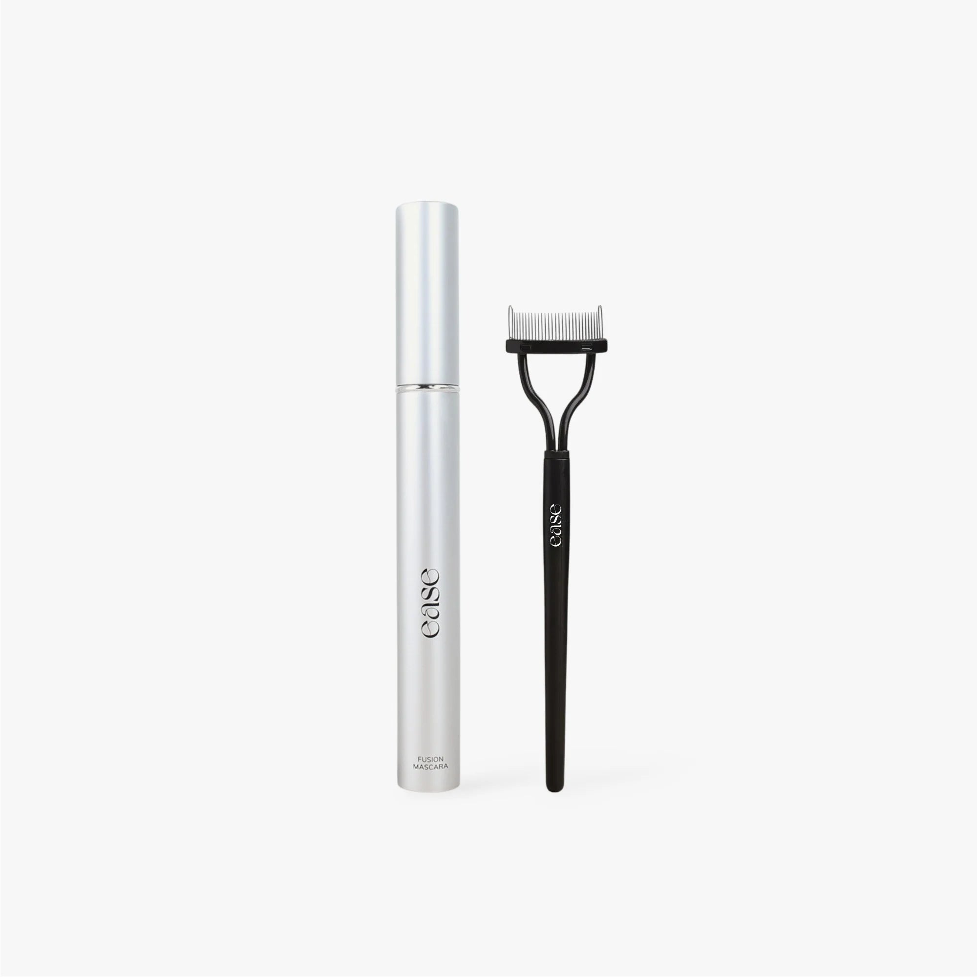 Mascara bottle and black lash comb on light gray background