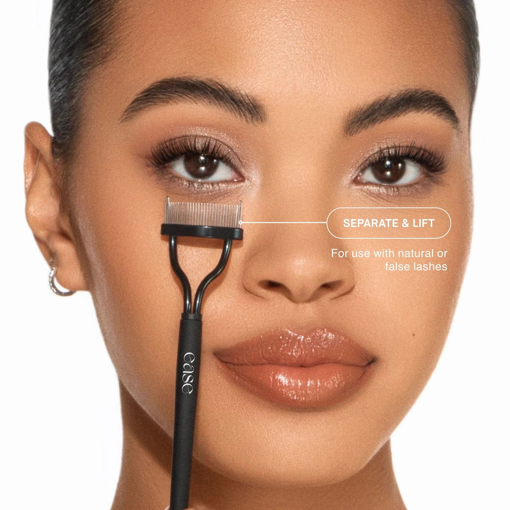 Eyelash comb held near a woman's eye with text indicating its use.